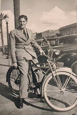 A person in a suit on a bicycle

AI-generated content may be incorrect.